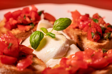 Caprese mozzarella and tomato salad with fresh basil leaves, Italian food