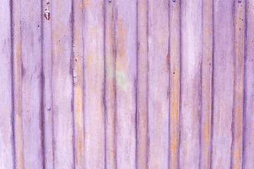 Purple light lavender peeling damaged old sprayed metal garage door texture bg