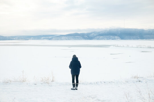 A woman walking in the winter landscape