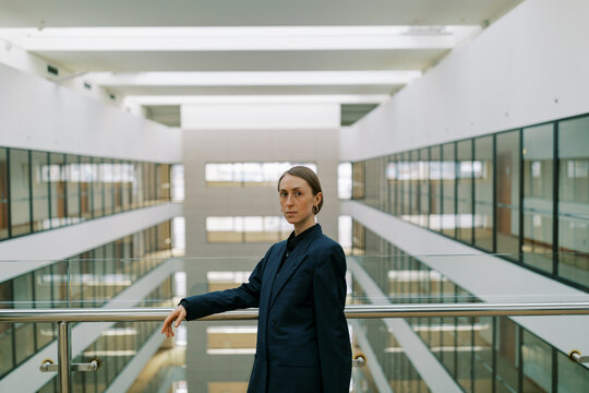  Portrait of business woman wearing man classic suite .