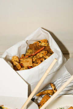 Asian chex mix snack food in paper bag