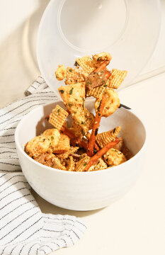 Chex mix snack in bowl on counter top 