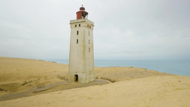 2022 - Sand surrounds the Rubjerg Knude lighthouse on Lonstrup Cliff in Denmark.
