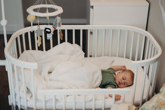 Cute newborn baby sleeping in cradle