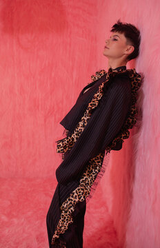Young woman in suit with leopard pattern details