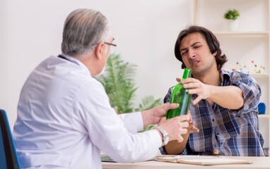 Young male alcoholic visiting old doctor