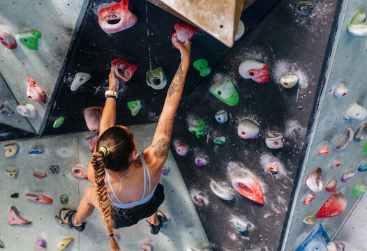 Woman climber on climbing wall