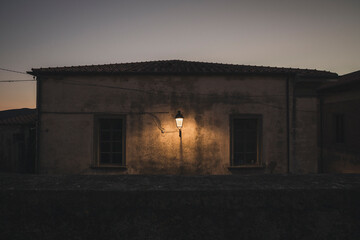 street lamp on the wall of a house