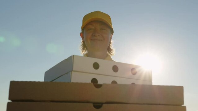 Pizza delivery man handing order to pov customer.