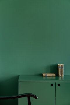 Detail of green wooden bedside table with two doors