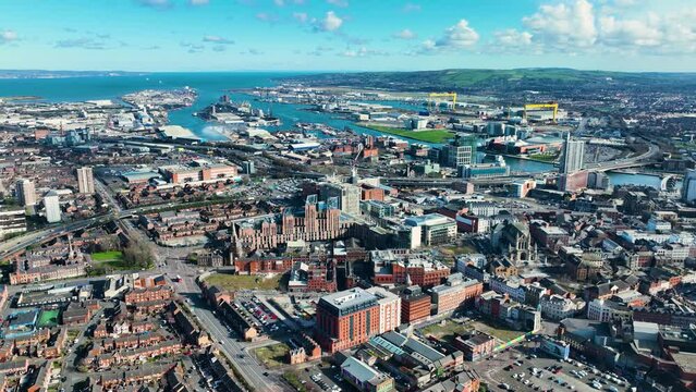 Aerial video of Belfast Cityscape Skyline on a sunny day in Northern Ireland