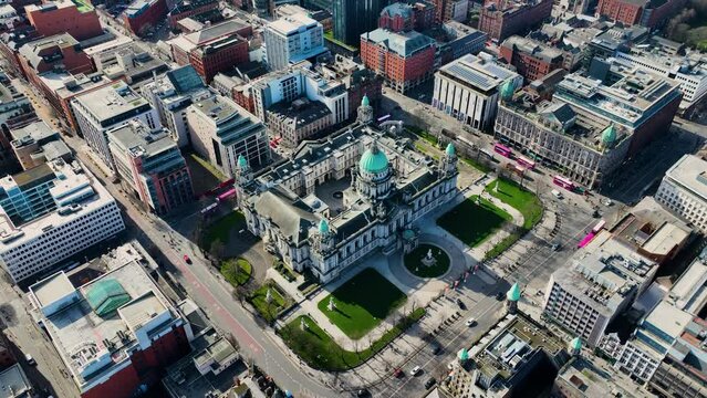 Aerial video of Belfast City Hall Cityscape Slyline on a sunny day in Northern Ireland 