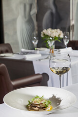 Mushroom Salad in french restaurant with white wine