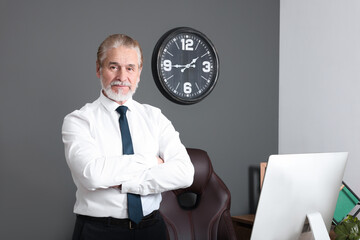 Serious senior successful boss in his office