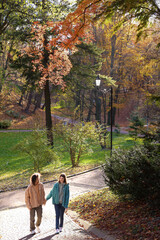Fototapeta na wymiar Happy young couple walking in autumn park. Dating agency