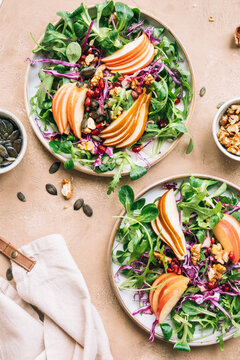 Fresh salad with apple, pear and pomegranate