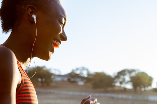 Woman's Face, Smiling While Working Out