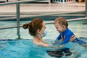 Boy With Cerebral Palsy At Pool Therapy