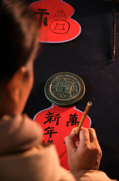 Make traditional Chinese New Year brush calligraphy decorations
