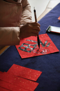 Make traditional Chinese New Year brush calligraphy decorations