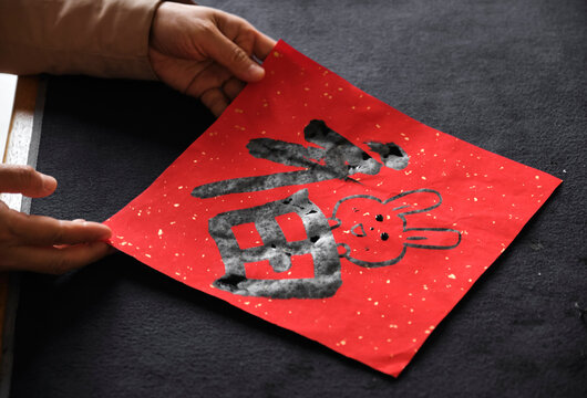 Make traditional Chinese New Year brush calligraphy decorations