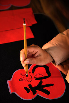 Make traditional Chinese New Year brush calligraphy decorations