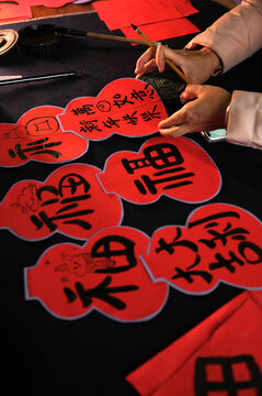 Make traditional Chinese New Year brush calligraphy decorations
