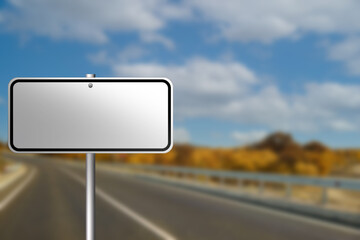 Blank road sign on empty asphalt highway, space for text