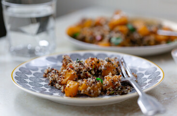 Healthy vegetarian warm salad of pumpkin and quinoa.