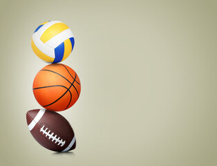 Stack of different sport balls on beige background, space for text