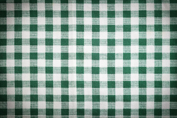 Green and white tablecloth as background, vignette effect