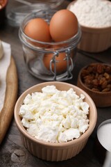 Different ingredients on wooden table. Cooking cottage cheese pancakes