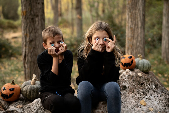 Happy children with Halloween accessories