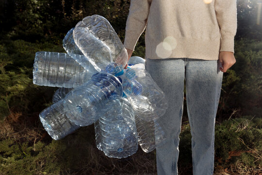 woman with plastic cans