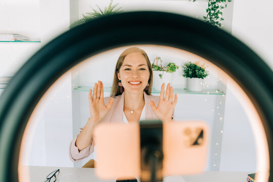 Woman recording video on her phone