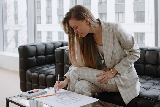 Businesswoman working with papers at the office