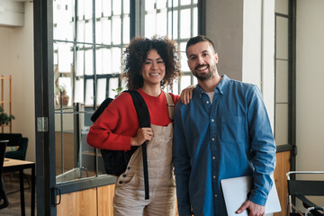 Cheerful coworkers standing At Office.