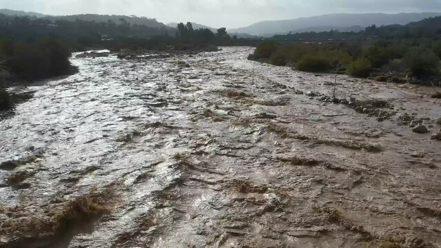 2023 - Excellent aerial footage of the heavy current in the muddy, flooded Ventura River in Ojai, California.
