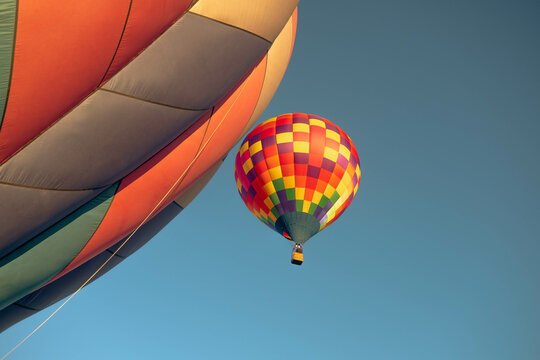Hot Air Balloon Among Bright Blue Sky