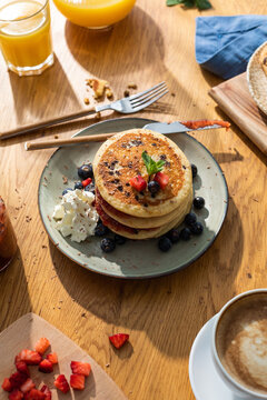 tasty pancakes with berries and cream