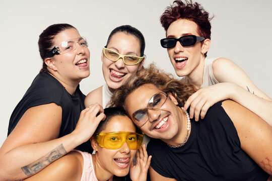Happy young adult group of friends youth culture concept