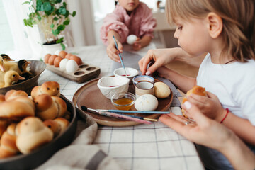 Family decorating cozy home for Easter.