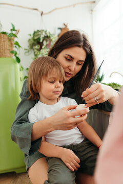 Mother with son preparing for Easter.