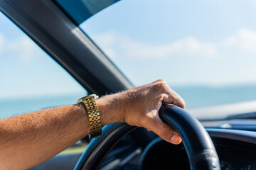 Arm With Clock Holding A Steering