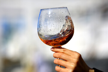 a glass of port wine in hand, portugal drink alcohol