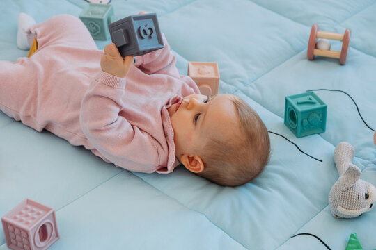 baby playing on mat