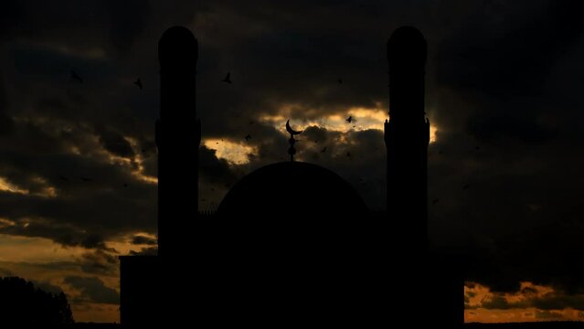 Time-lapse Sunset and Mosque Silhouette. Birds Flying Around the Mosque. 07.