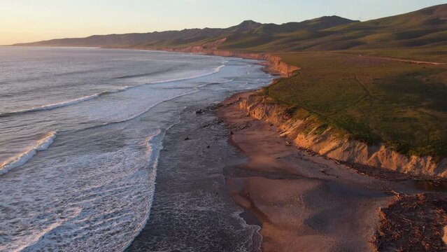 2023 - Excellent aerial footage of waves lapping the shores of Jalama Beach, California.