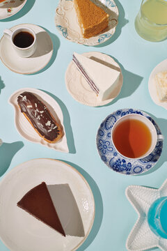 many pieces of different cakes and different drinks