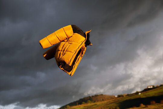 a yellow jacket in the air 